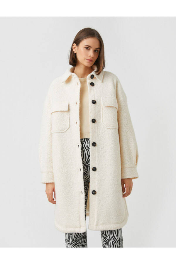 Long coat with a pocket on the collar - 9