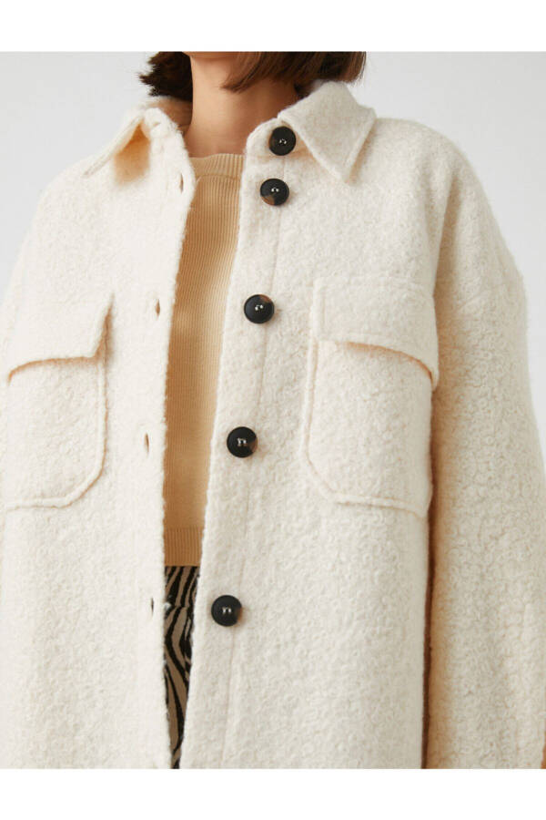 Long coat with a pocket on the collar - 11