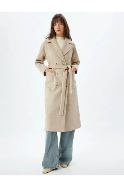 Long, double-breasted, pocket and belt detailed cashmere coat. - 29