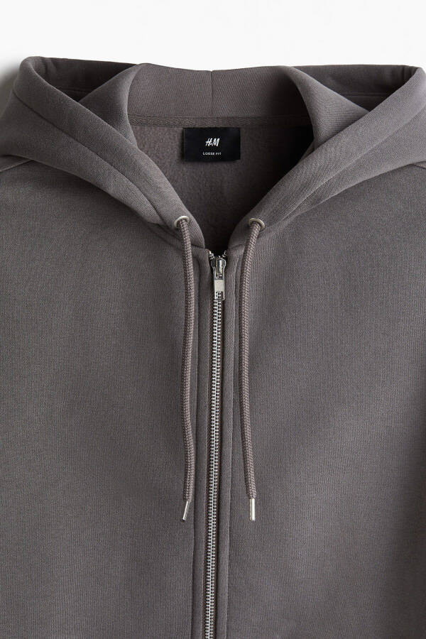 Loose fit hooded sweatshirt with zipper. - 2