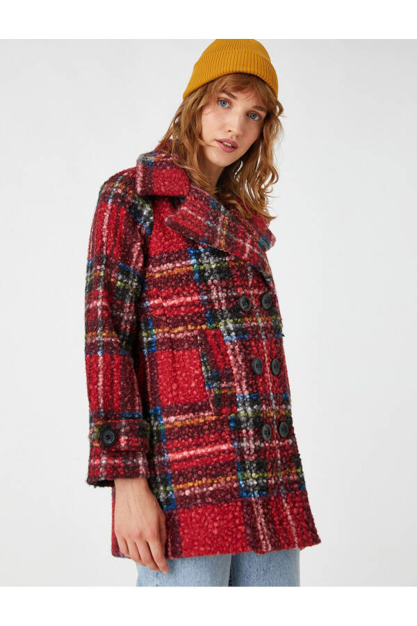 Loose-fitting coat with buttoned crossover closure. - 1