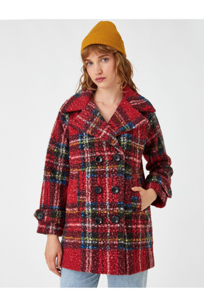 Loose-fitting coat with buttoned crossover closure. - 3