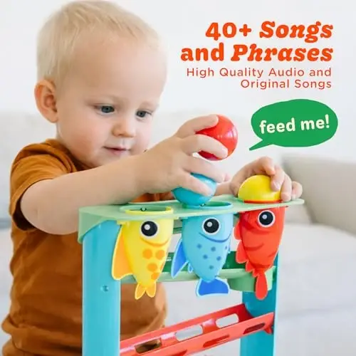 Move2Play, Feed The Fish | 30+ Fin-Tastic Songs & Phrases | Baby & Toddler Musical Toy | First Birthday Present for 1+ Year Old | Ages 6-24 Months | Boy & Girl Ball Drop Toy 