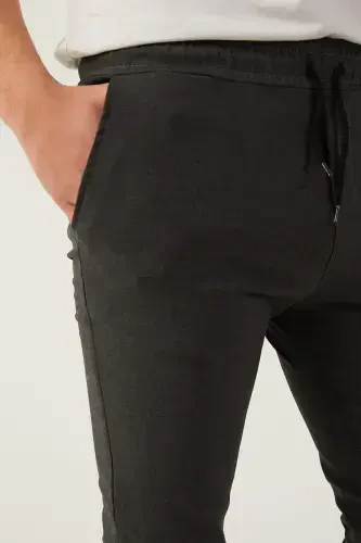 Мужские спортивные штаны с эластичным поясом и узким кроем - 4