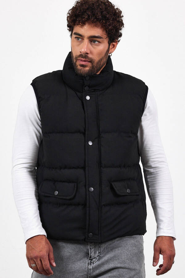 New season men's padded black puffer vest with zipper and snap closure. - 2