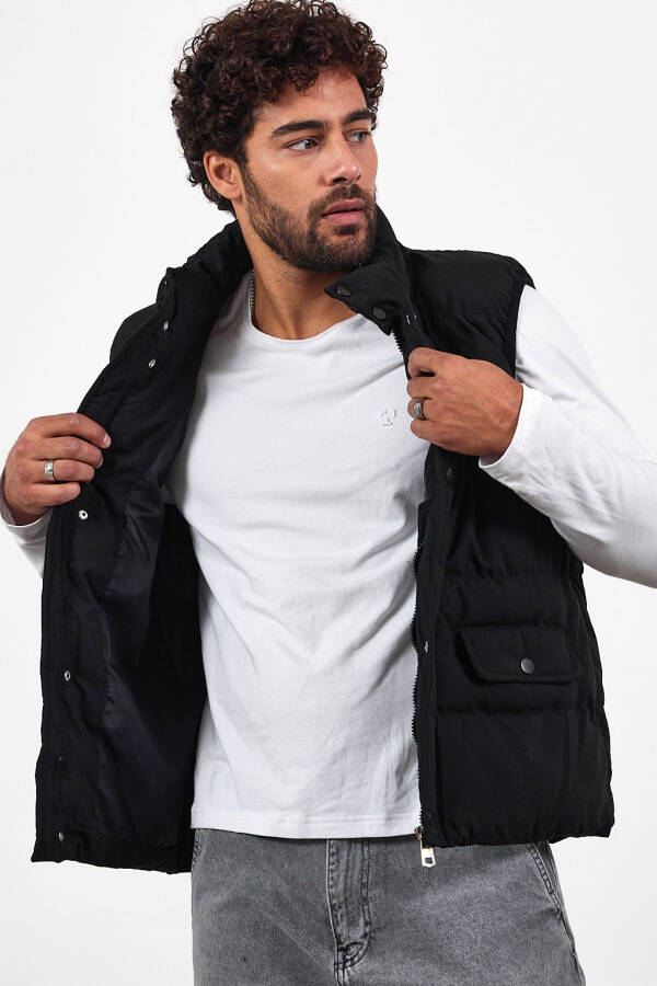 New season men's padded black puffer vest with zipper and snap closure. - 3