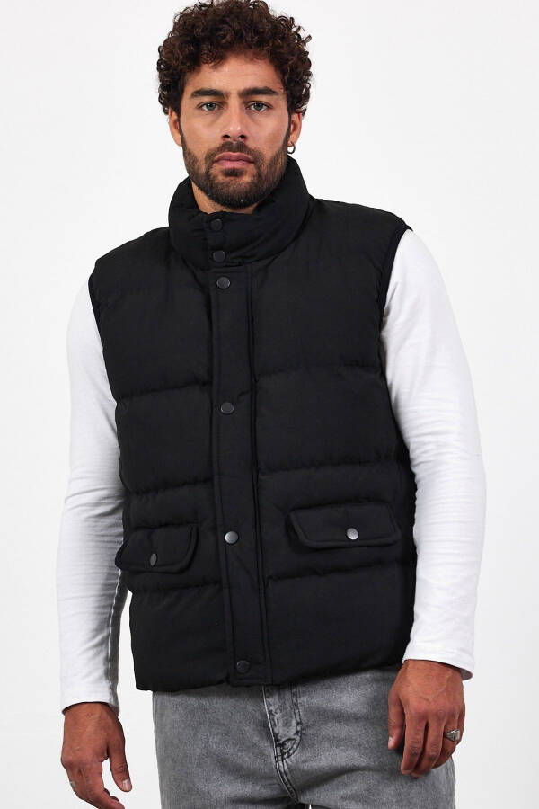 New season men's padded black puffer vest with zipper and snap closure. - 5