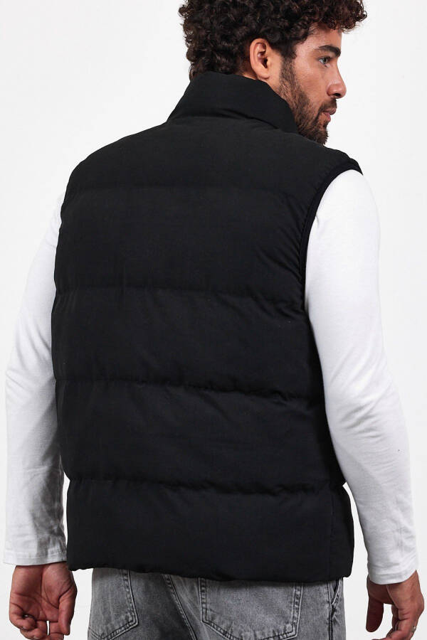 New season men's padded black puffer vest with zipper and snap closure. - 8