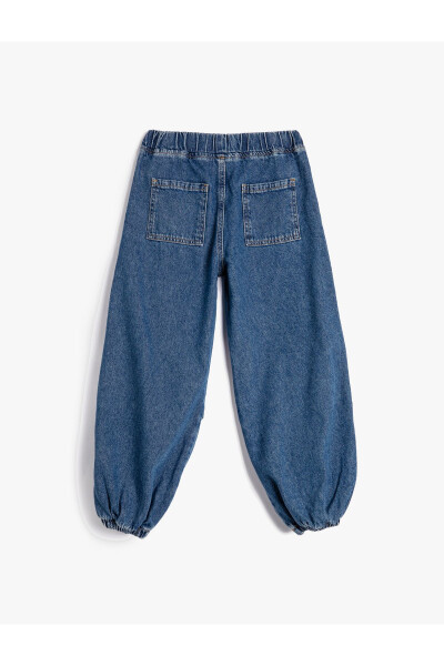 Parachute jeans with folded details and pockets. - 9