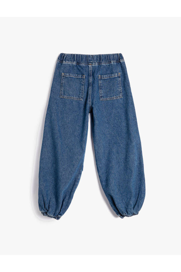 Parachute jeans with folded details and pockets. - 9