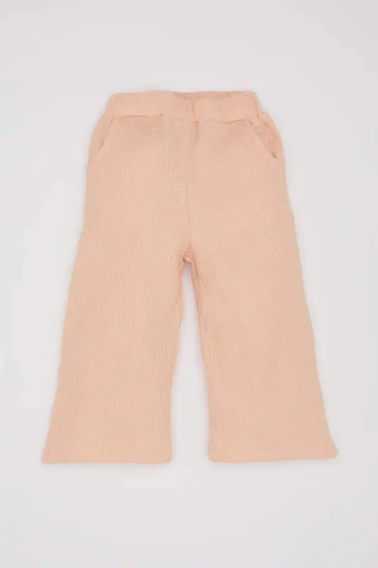 Қиз бола 2-ли костюм. Вафли матоли, велосипед ёқали, босилган свитер. Белбанди резинли, кенг, эркин пайча шим. - 2