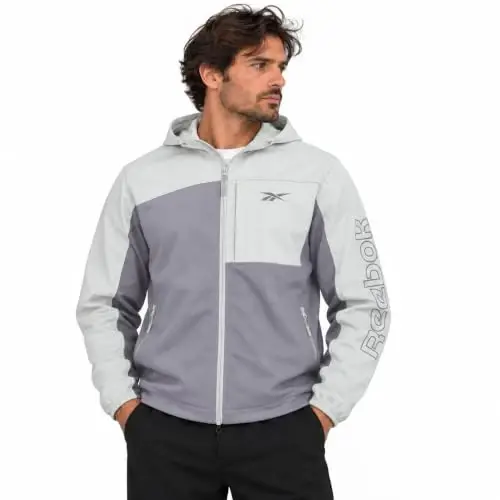 Reebok Mens Lightweight Fleece-Lined Softshell Jacket, Wind Resistant Hood | Wind and Water Resistant Shell for Daily Commutes or Travel, Streamlined Athletic Cut, Protective Collar for Chilly Mornings - 1