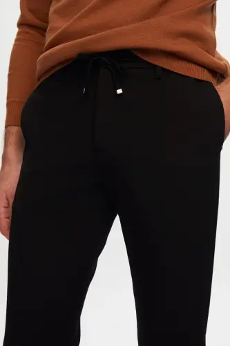 Slim Fit qora rangli elastik kamarli bog'lamali fermuarli likrali qulay jogger shim - D'S DAMAT (1)