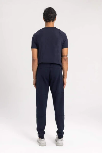 Спортивные брюки DeFactoFit Slim Fit с двумя карманами, эластичными штанинами, из ткани для подводного плавания Scuba, темно-синего цвета - 9