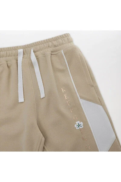 Спортивные штаны для девочек бежевого цвета - 11