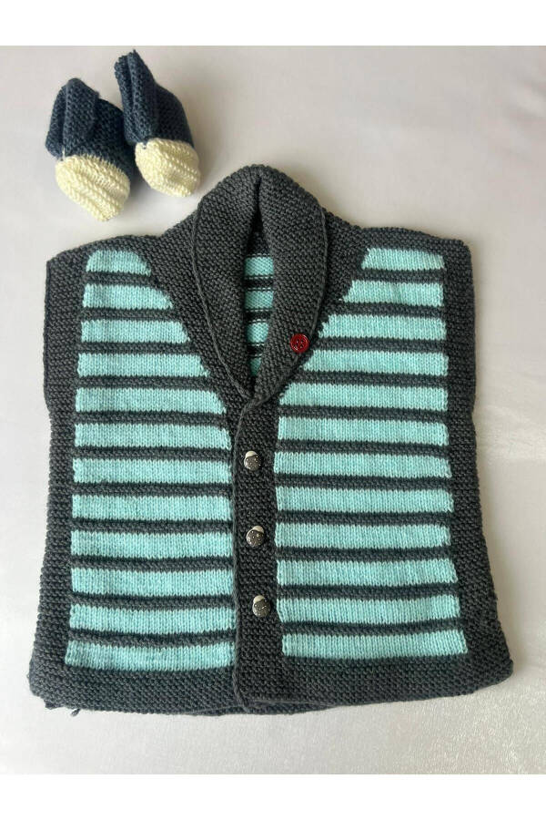 Sweater and booties for a newborn baby boy. - 2