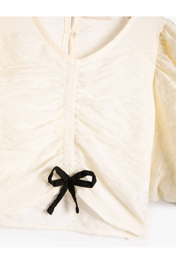 V-neck, short balloon sleeve, gathered front viscose fabric blouse. - 6