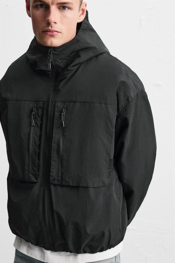 Waterproof hooded jacket (Black) - 15