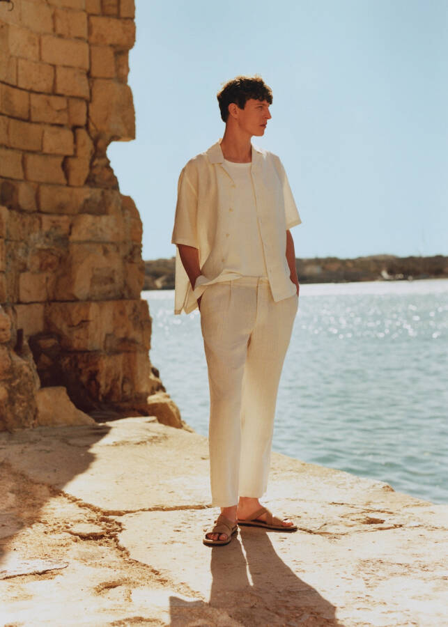 White linen pants with stripes and pleats. - 1