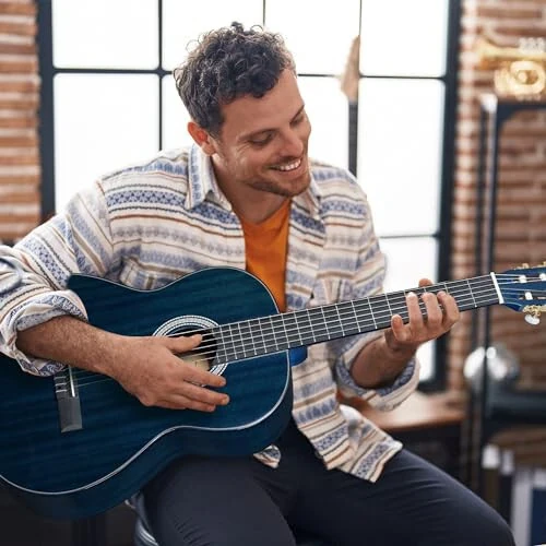 WINZZ 4/4 Classical Guitar, 39 Inch Full Size Nylon String Guitar for Beginner Adults, Full Classic Guitar Kit with Free Lessons, Gig Bag, Footstool, Capo, Tuner, Hanger and Strap (Glossy Blue) - WINZZ (1)