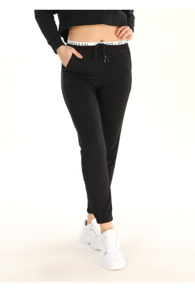 Women's Black Elastic Narrow Leg Elastic Waist Side Stripe Detail Slim Fit Sweatpants Pogi - 1