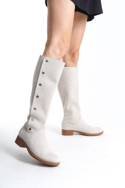 Women's designer suede boots with buttons. 