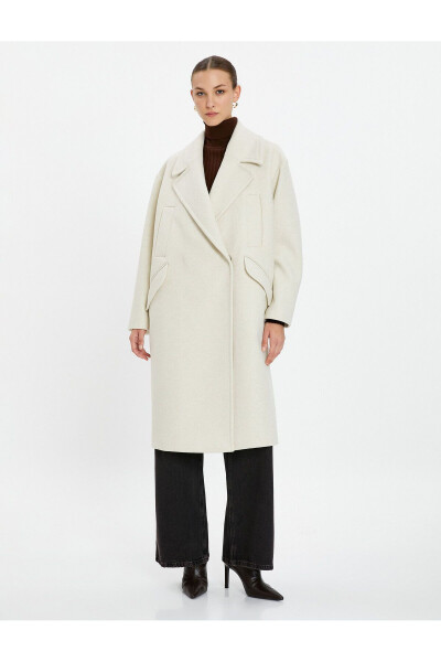 Wool coat with double-breasted closure and hidden pocket detail. - 3