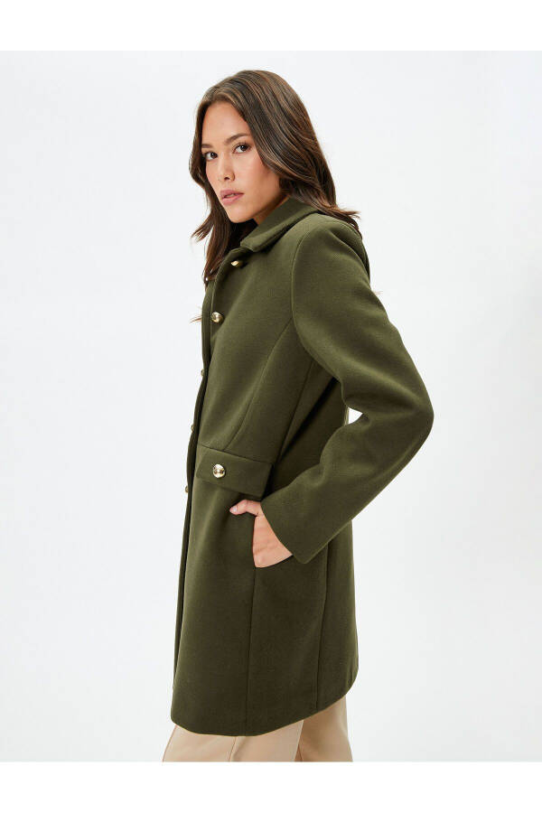 Wool coat with gold buttons, turn-down collar and pockets. - 9