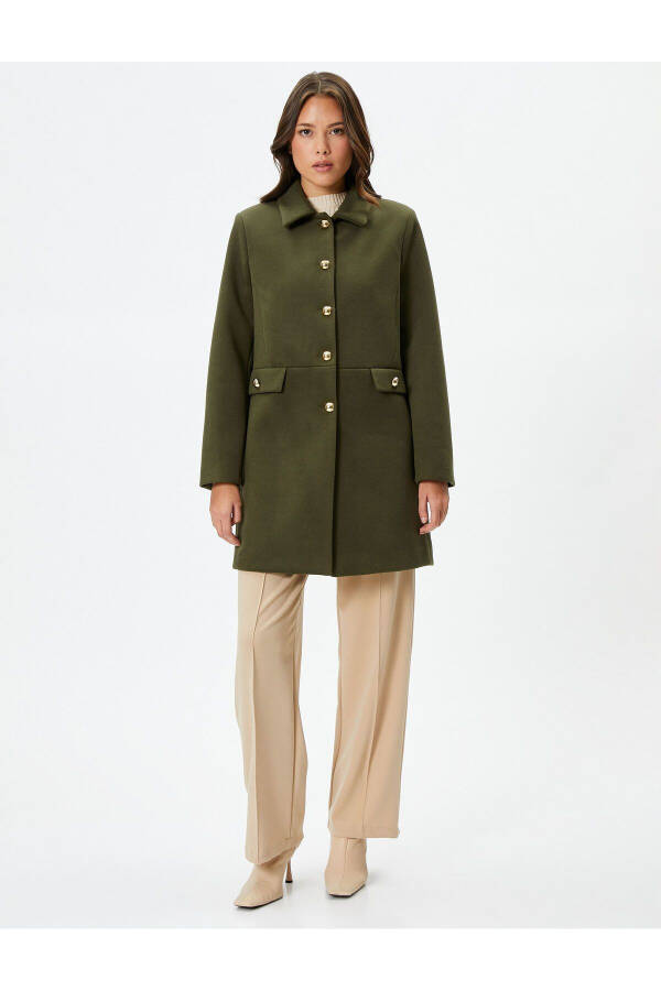 Wool coat with gold buttons, turn-down collar and pockets. - 11