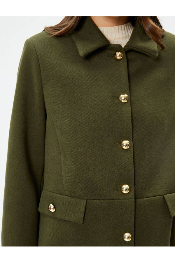 Wool coat with gold buttons, turn-down collar and pockets. - 13