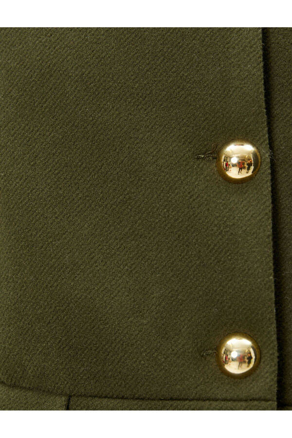 Wool coat with gold buttons, turn-down collar and pockets. - 16