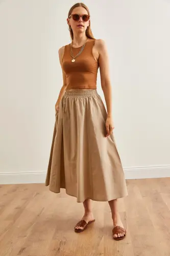 Женская тканая миди-юбка клеш с эластичной талией, с каменными карманами - 3
