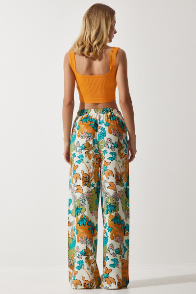 Женские широкие вискозные брюки цвета экрю с бирюзовым рисунком EN00606 - 7