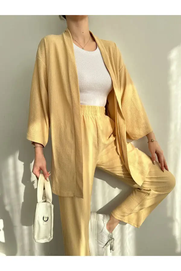 Женский трикотажный костюм с брюками-кимоно бежевого цвета - 4